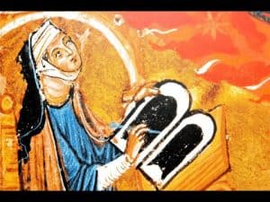 Medieval illustration of Hildegard von Bingen writing.