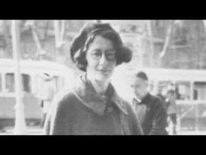 Black and white photo of Simone Weil, wearing a beret.