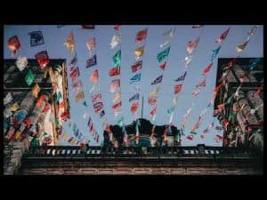 Colorful papel picado banners strung between buildings in Mexico.