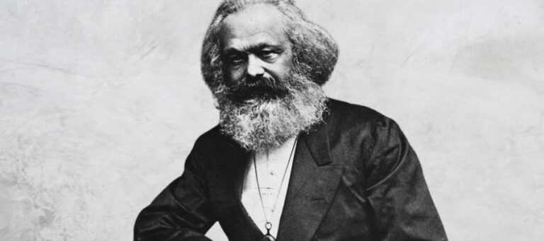 Black and white portrait of Karl Marx, philosopher and economist.