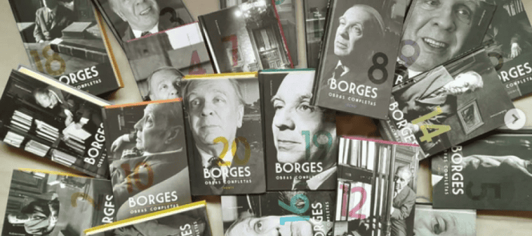 Collection of Jorge Luis Borges' complete works books. "Obras Completas" visible on many covers.