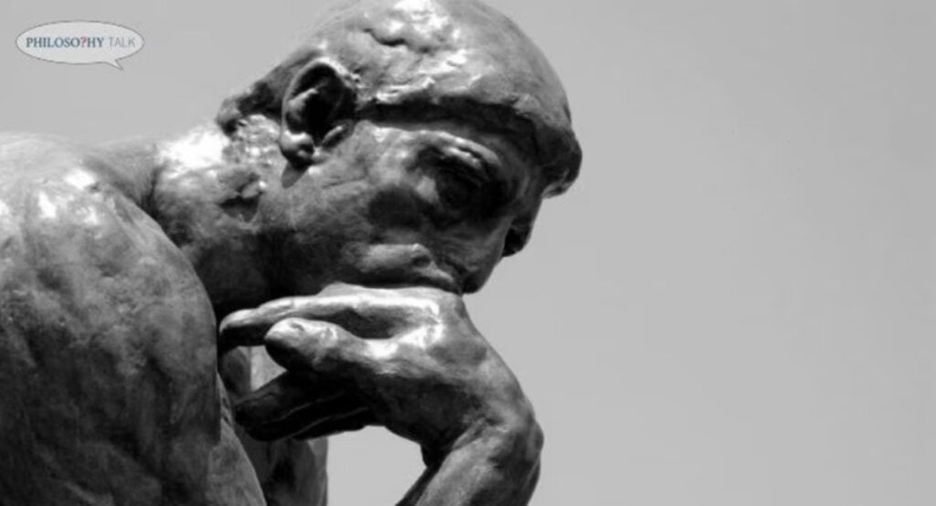 Close-up of Rodin's "The Thinker," contemplating the future of philosophy.