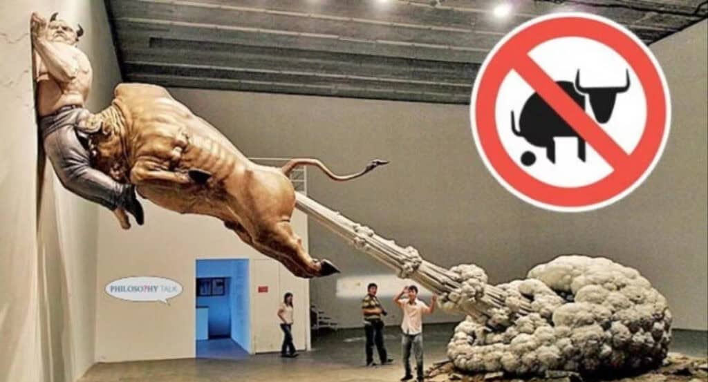 Surreal sculpture of a man riding a bull, defecating a column, with a "No Bull" sign. Truth vs. BS.