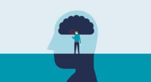 Person exploring a dark cloud representing mental imagery with a magnifying glass.