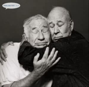 Two elderly men embrace, showcasing the beauty of aging and a well-lived life.