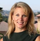 Headshot of a blonde woman, smiling.