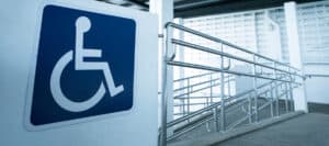 Accessible ramp with handrails and disability symbol