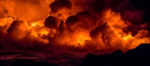 Fiery orange and black cloudscape, resembling a hellish inferno.