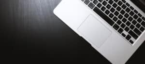 Laptop computer on dark wood desk
