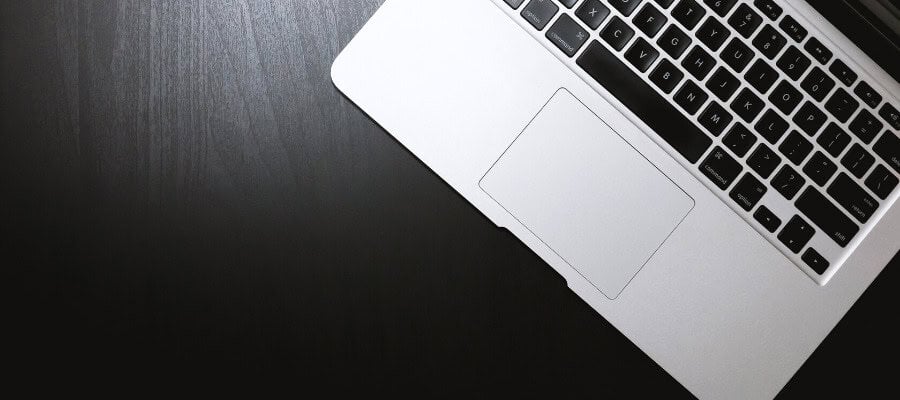 Laptop computer on dark wood desk