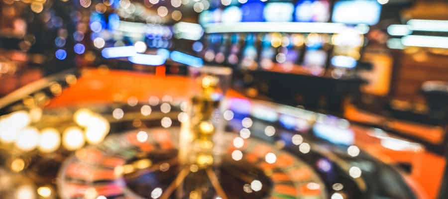 Blurred image of a roulette wheel in a casino, showcasing the excitement of gambling.
