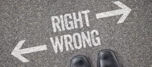 Footwear at a crossroads; arrows point to "RIGHT" and "WRONG," illustrating moral dilemmas and ambiguity.