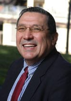 Happy man in suit, discussing immigration and citizenship.