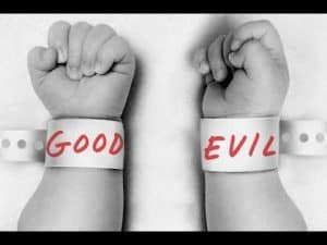 Two newborn babies' wrists, one labeled "Good," the other "Evil," explore the nature vs. nurture debate in morality.