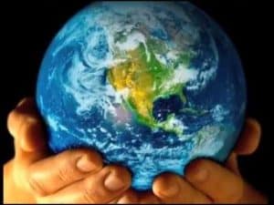 Hands cradling Earth, representing pantheistic worldview.