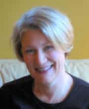 Smiling woman with short blond hair