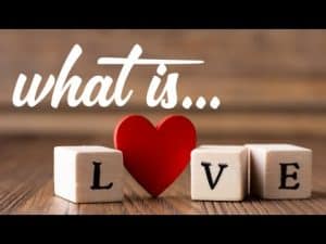Red heart with wooden blocks spelling "LOVE".