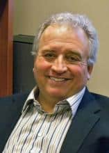 Portrait of a smiling man in a business suit