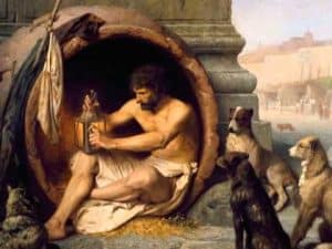 Diogenes, the Cynic philosopher, sits in a barrel, examining a lantern. Dogs are nearby.