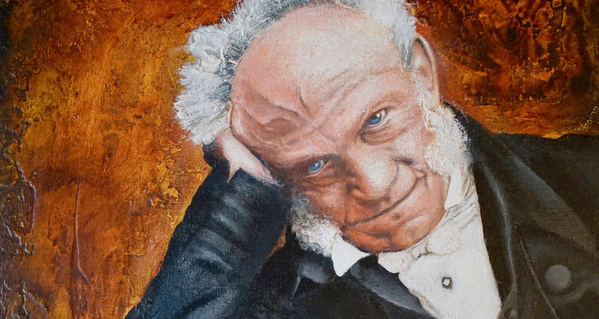 Close-up portrait of an elderly man with a thoughtful expression, hand resting on his chin.