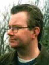 Headshot of philosopher, contemplating morality.
