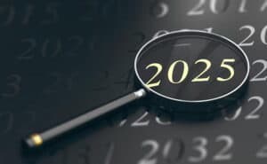 Magnifying glass over "2025" on a calendar. The Examined Year: 2025.